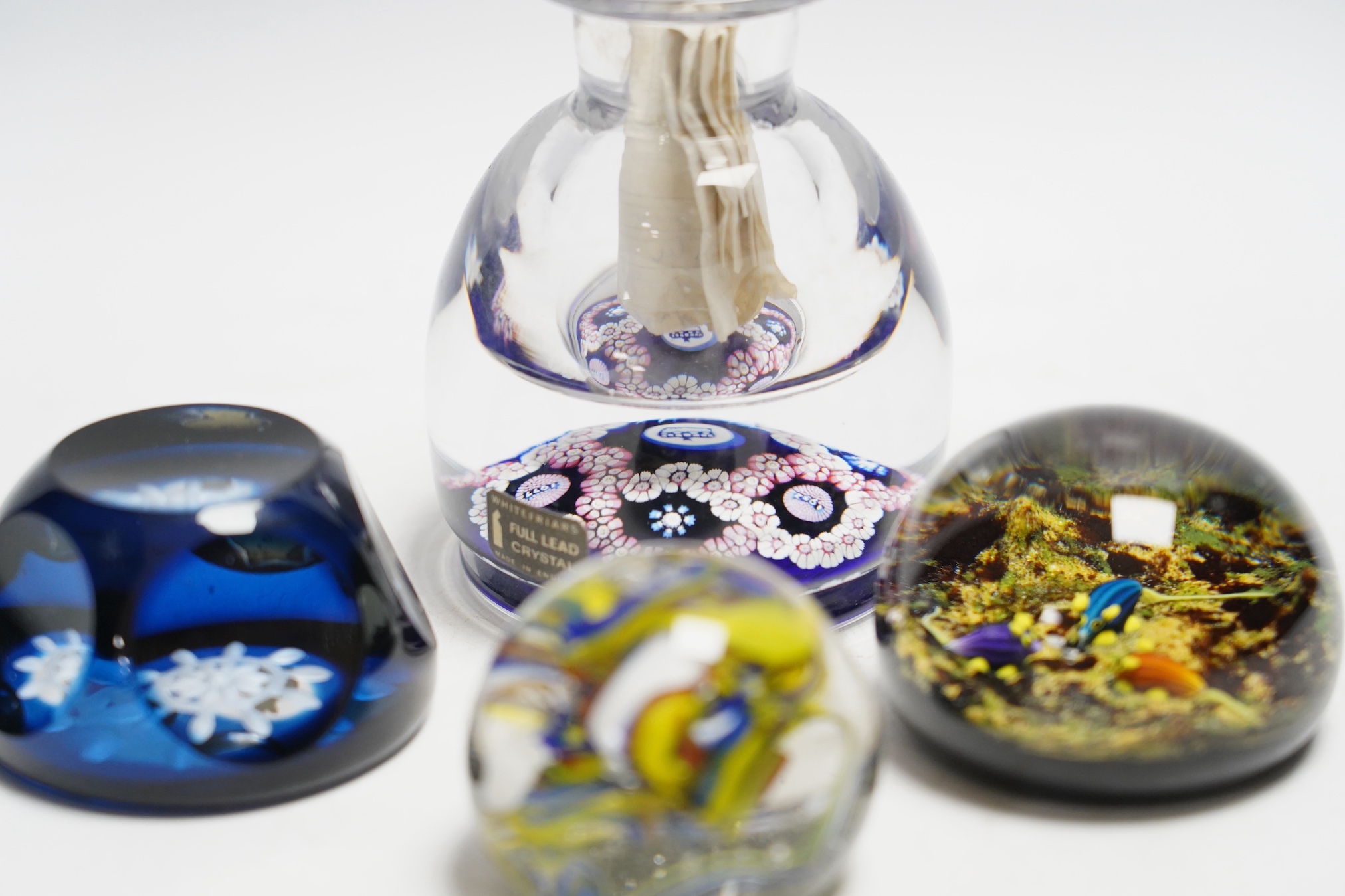 A collection of boxed Whitefriars and Caithness paperweights and others (10)
